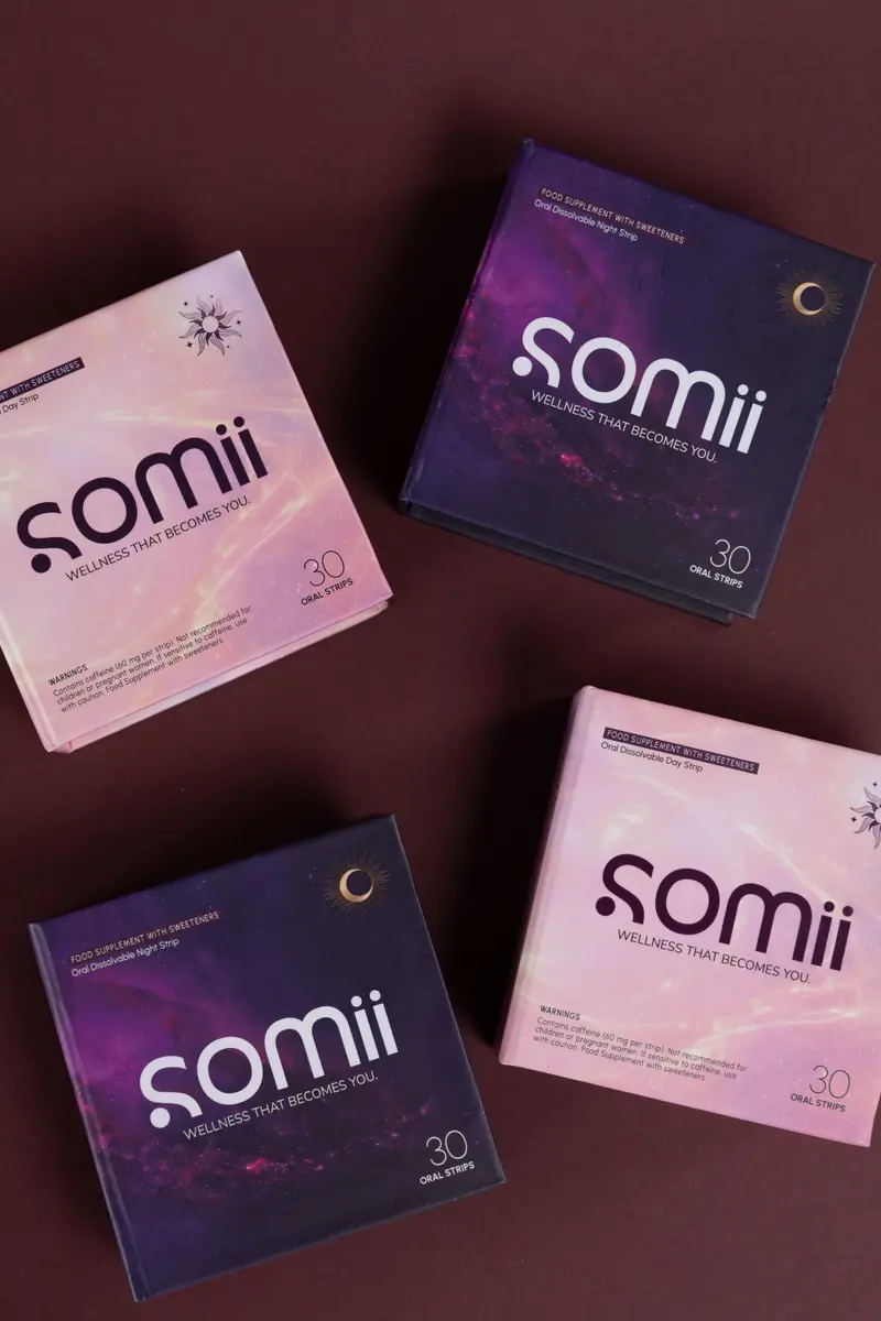 Four Somii boxes arranged on a deep Bordeaux backdrop